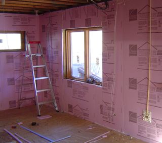 XPS foam board insulation on the inside of concrete foundation walls