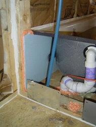 home building insulation and air barrier behind bathtub