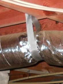 hvac flex duct supported by strap in crawl space