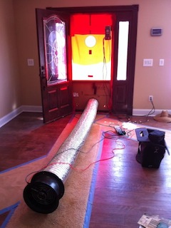 Doing a blower door test on a tight house with a Duct Blaster fan