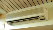 A ductless mini-split heat pump head is visible in the home.