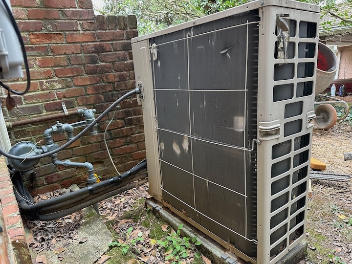 The back side of the heat pump outdoor unit without frost