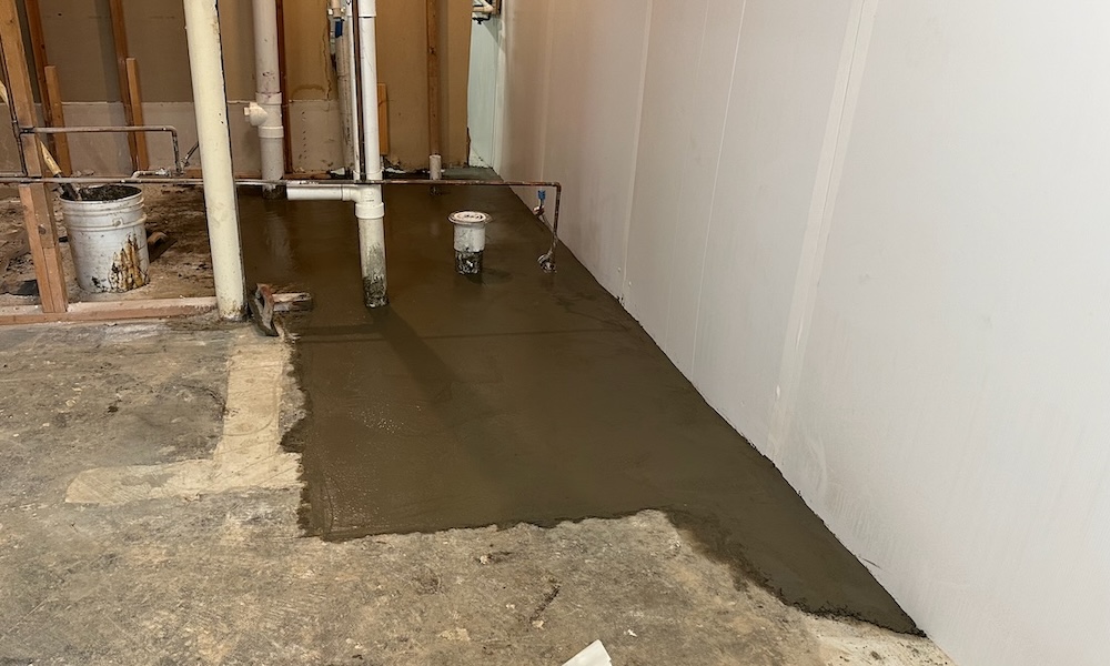Basement slab holes closed up, helping with radon reduction