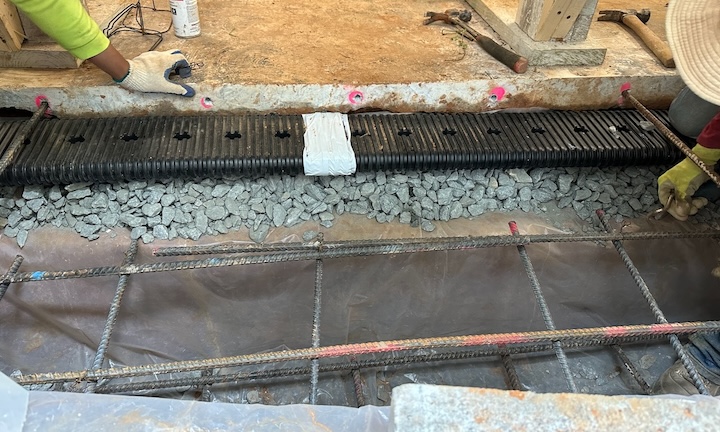 Pouring a new footing meant rerouting the interior perimeter drain