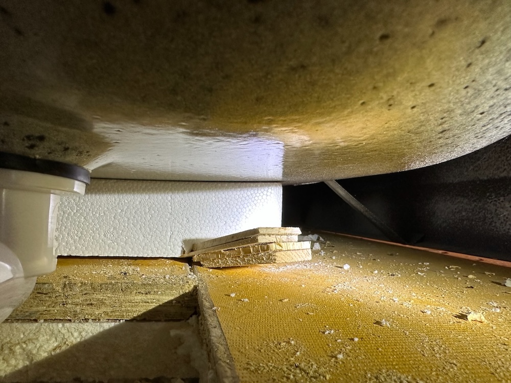 Bathtub shims beneath foam