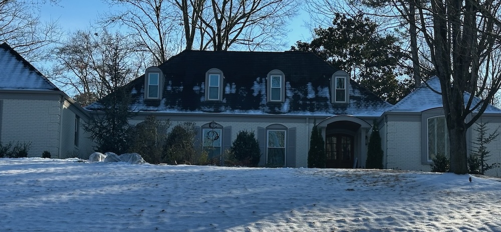 A complex roof with a lot of the snow gone