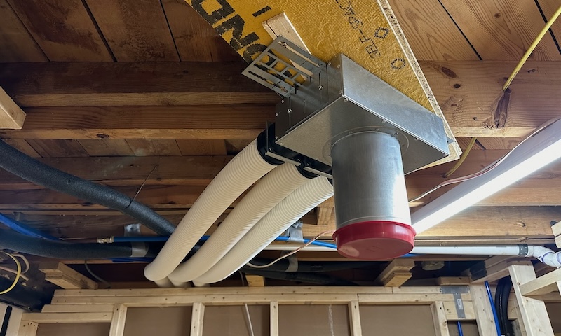 A register box (aka, boot) installed on the ceiling of one of the basement bathrooms